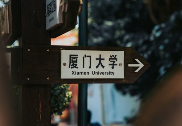 A Comparison of Common Application Systems: centralized portals vs direct university applications shown on a laptop screen