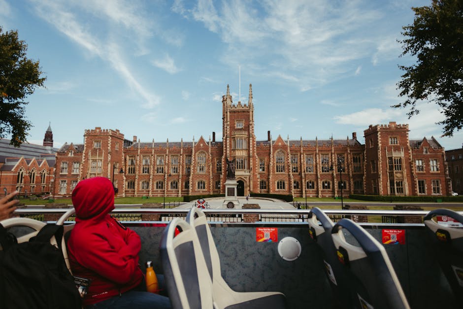 Student attending a university open day while talking with an advisor on campus