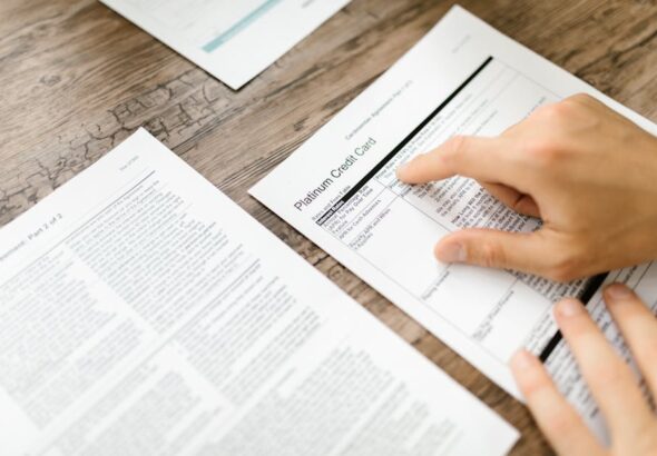 Student reviewing a Course Catalog Deep Dive, evaluating curriculum credits and graduation requirements at a desk