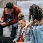 Students using laptops with Essential Student Resources: Best Online Platforms for Research, Writing, and Academic Support tools.