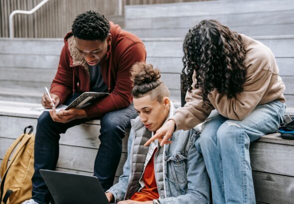 Students using laptops with Essential Student Resources: Best Online Platforms for Research, Writing, and Academic Support tools.