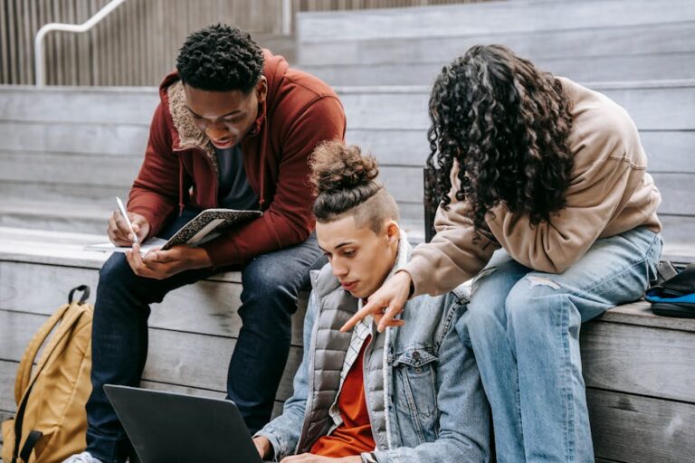 Students using laptops with Essential Student Resources: Best Online Platforms for Research, Writing, and Academic Support tools.