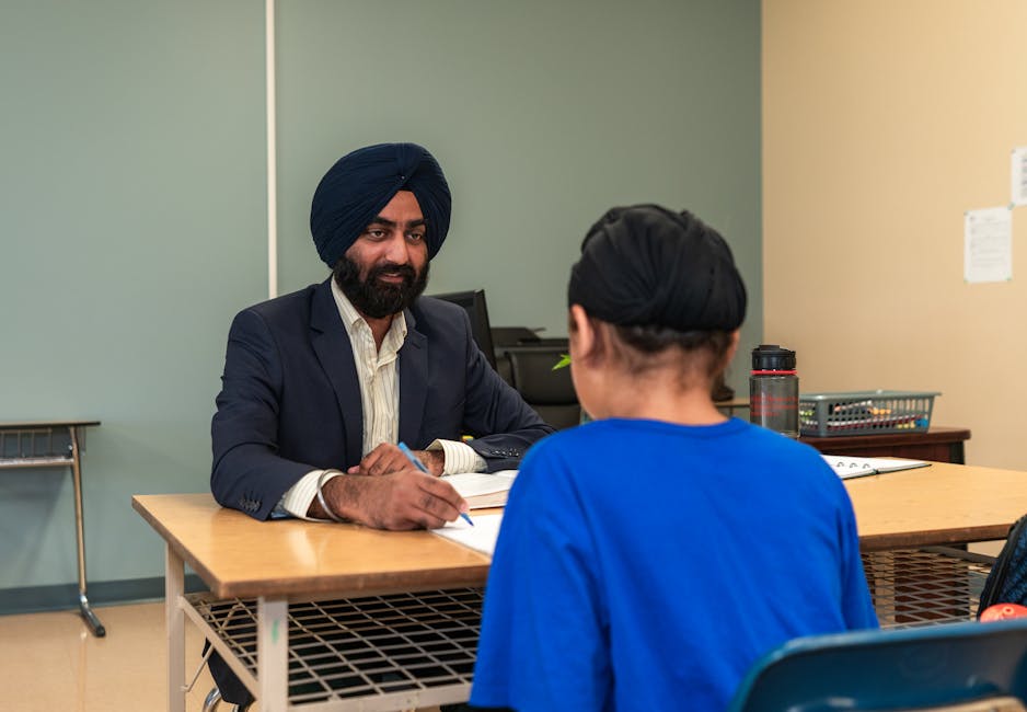 Student practicing interview answers at a desk with notes and a phone timer