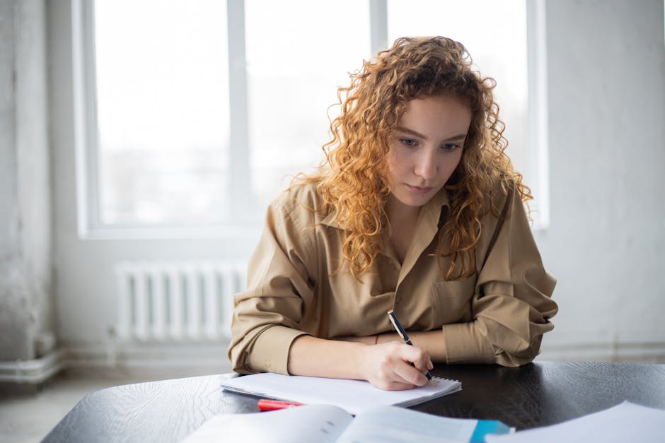Student reviewing course requirements and module list in a study space