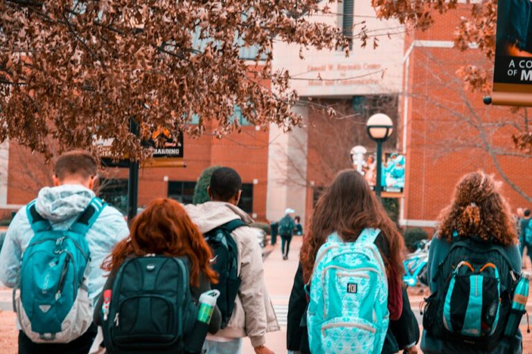 Students walking on campus paths in a Campus Life 101 guide, exploring options for the right student experience.