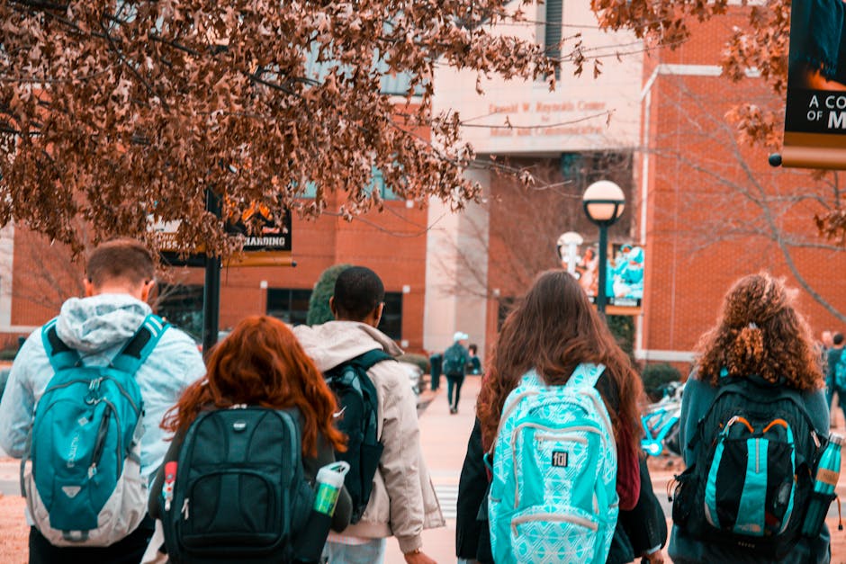 Students walking on campus paths in a Campus Life 101 guide, exploring options for the right student experience.