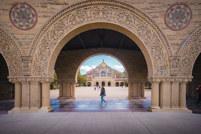 Students on campus near a library, comparing Campus Life vs. Academics in a framework beyond rankings (Pexels).