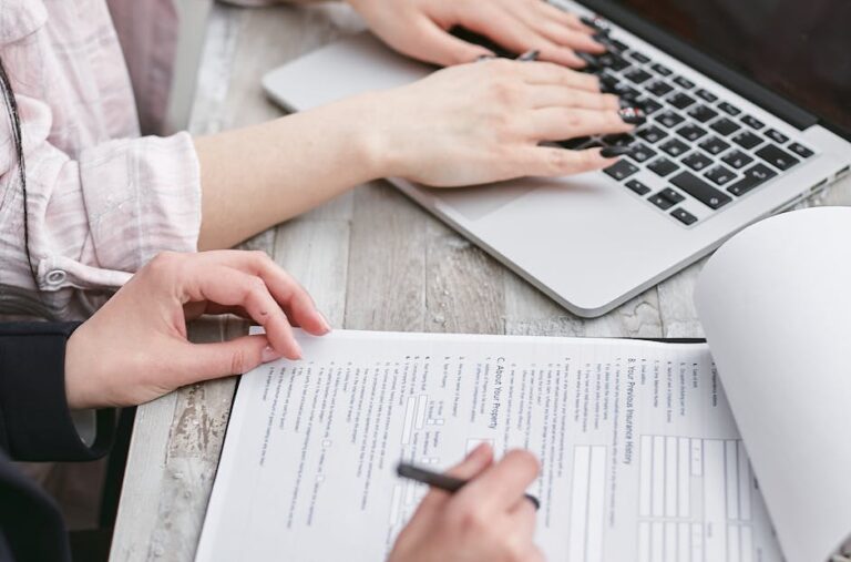 International Student Readiness Checklist: Visas, Housing, Health Insurance, and Budgeting on a desk with documents and notes.