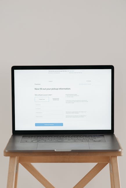Person reviewing an online university application form on a laptop before submitting