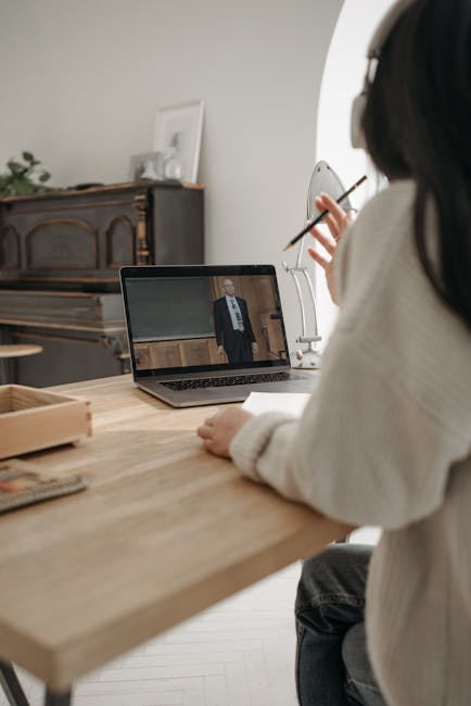 Student studying on a laptop for an online course, showing digital learning setup