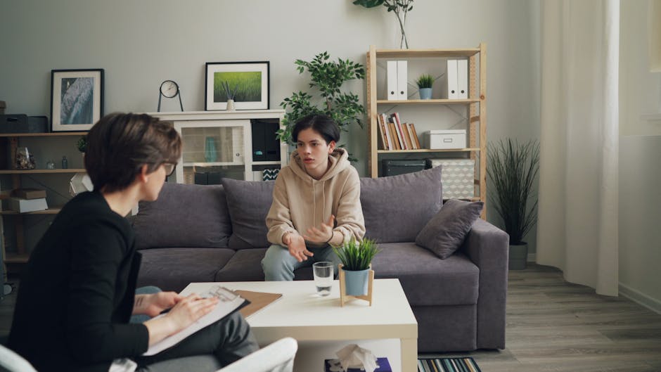 Advisor meeting a student in a bright campus support office