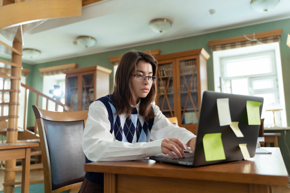 Student revising an admissions essay on a laptop, highlighting common readability mistakes.