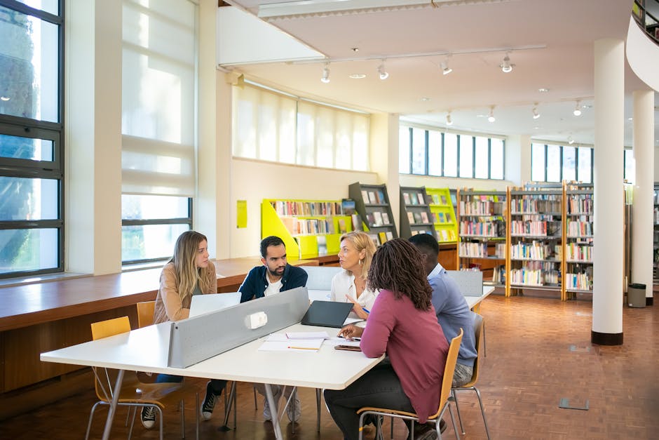 Students studying together in a university library during a busy term