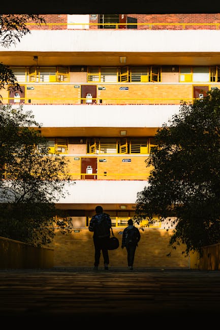 Students enjoying Campus Life Deep Dive in a shared dorm lounge during daily student living, bright morning light.