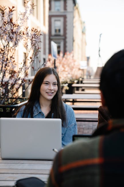 Student reviewing university program pages, tuition, and eligibility on a laptop