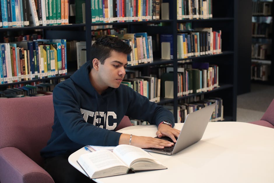 Student reviewing course details in a library, highlighting what rankings miss